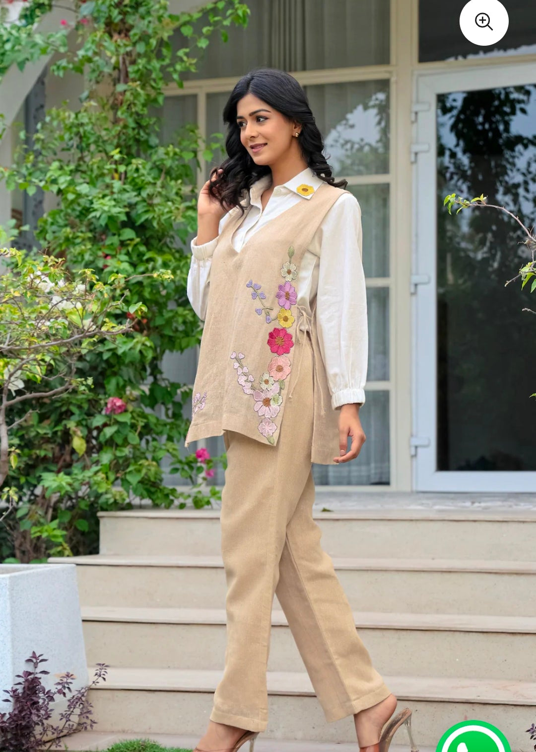 Woman in a beige outfit with floral details standing outdoors, with a shopping app interface overlay.